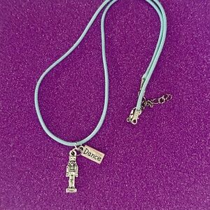 Nutcracker Necklace. Nutcracker and Dance charm with faux leather blue necklace
